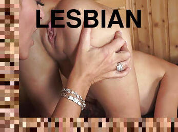 Old-Young lesbian couple lick each other's clits in a sauna