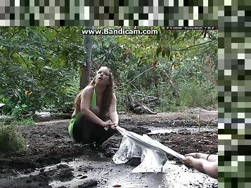 Two amateur babes getting dirty & drowning in mud outdoor