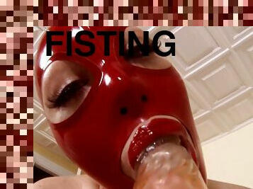 Kinky Paige Delight blows cock in a red latex mask