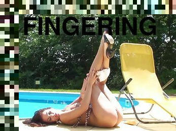 Solo Billy Raise wearing high heels fingering herself by the pool