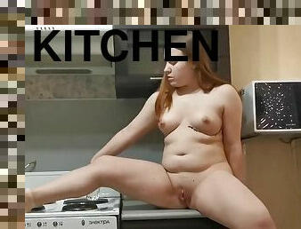 Horny babe masturbating in the kitchen for you