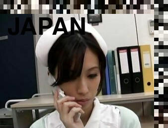 Horny Japanese nurse Anna Noma moans while playing with a dildo
