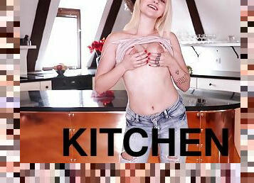 Home alone babe Marilyn Sugar pleasures her pussy in the kitchen