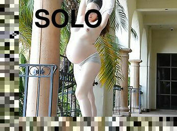 Pregnant solo model Audrey drops her clothes to tease the camera