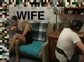 Fucks a friend's wife while he plays a computer game
