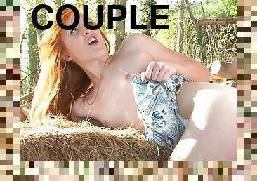 Redhead gets fucked by a pile of hay