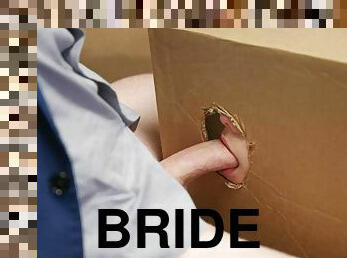 Bride to be sucking dick through shipping box hole