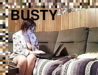 Horny busty girl watching porn and masturbating