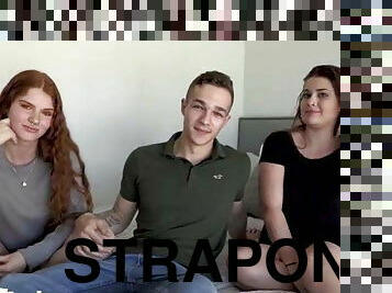 Two redhead girls fuck a guy with a strapon