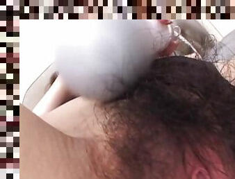 Tomoe Hinatsu massages her hairy cunt with a vibrator and gets nailed