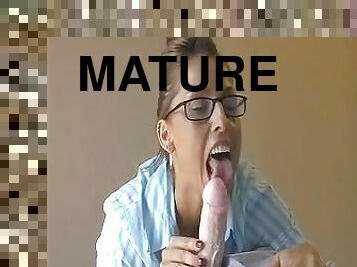 Mature amateur with glasses takes a fat dick in her horny mouth