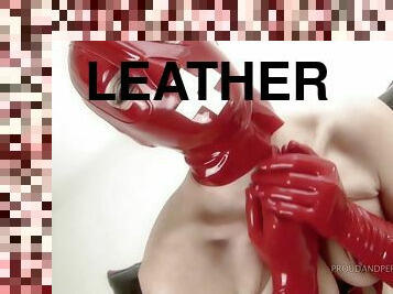 Madame Adore dressed in full leather red outfit rides a fuck machine
