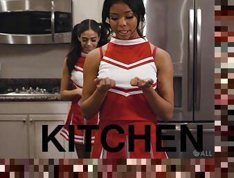 Petite cheerleaders Nia Nacci and Harmony Wonder having sex in the kitchen