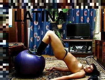 Shameless little candy with dark hair performs a solo on a Pilates ball