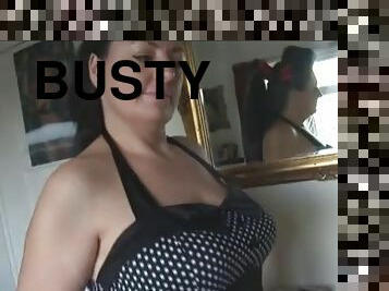 Busty brunette masturbates solo