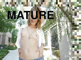 Mature amateur blonde MILF Mona exposes her tits in public