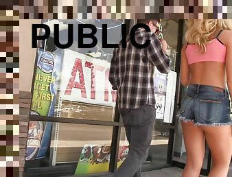 Blonde babe in shorts Katerina Kay sucks a glory hole cock in public