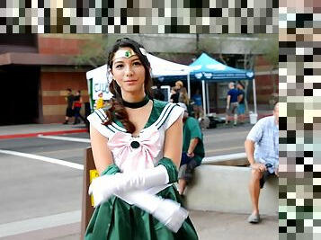 Beautiful girl Melody wears a costume while she walks outdoors