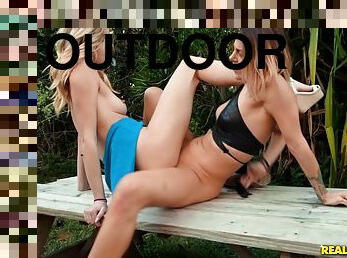 Haley Reed and another hottie lick each other's pussies outdoors