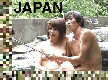 Japanese hottie gets her boobs massaged by a friend outdoors