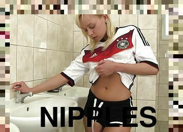 Solo blonde Naomi Nevena rubs her pussy and sucks her nipples