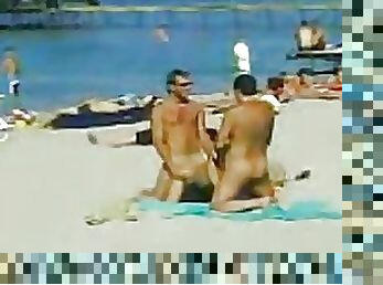Two Guys and One Sexy Babe Have a Hot Threesome on a Nude Beach