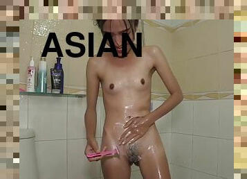 ULTRA-SMALL THAI SPINNER SHOWER AND SHAVES PUSSY FOR CLIENT