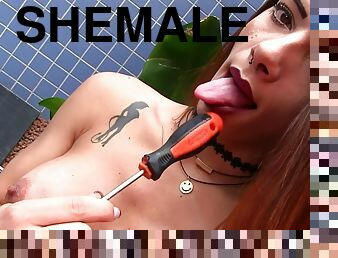 Shemale Marcelle Herrera masturbates with a screwdriver