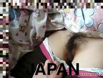 Sleeping Japanese girl gets her bushy pussy examined and fingered