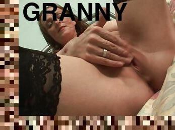 Classy Granny in stockings fingering her pussy seductively