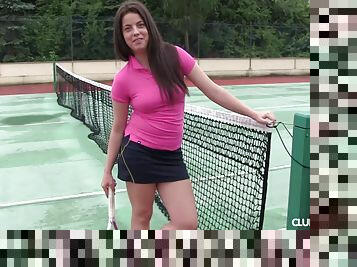 A busty girl in a tight shirt waiting for her tennis instructor