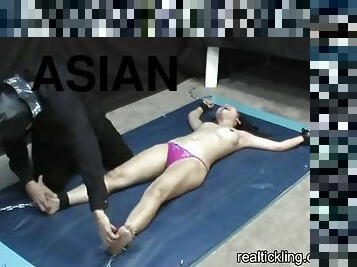 Asian girl tickled spread eagle