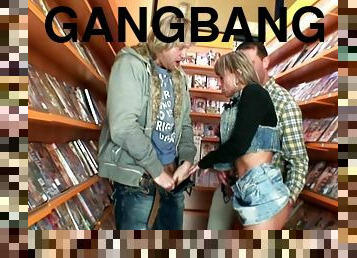 Blond slut takes gangbang in video store then gets her face covered in cumshots