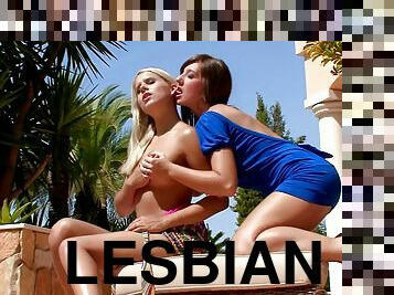 Seductive lesbian chics relaxing outdoors after a hard day