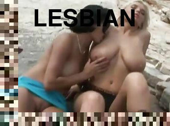These hot and horny lesbians lick and fuck each other on the beach