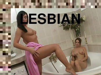 Fantastic lesbians with natural tits fucking with toys in the bath tub