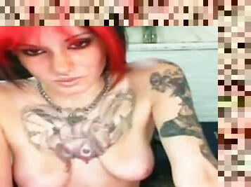 Tattooed redhead slut shows her natural tits for the webcam