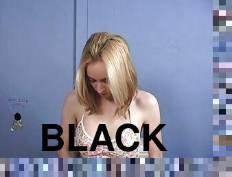 Kelly Wells sucks a massive black dick sticking out of a gloryhole
