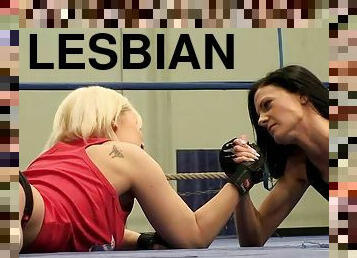 Blonde and brunette chicks having lesbian sex in the ring