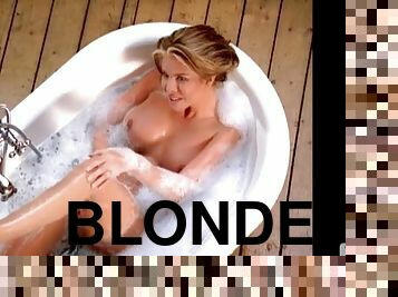 Fabulous blonde babe Tyran Richard takes a bath and poses for the cam