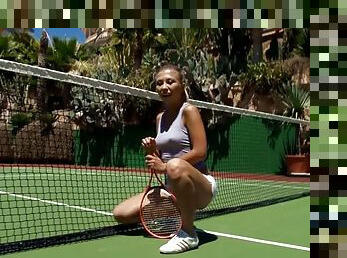 Amazing blonde girl masturbates on a tennis court