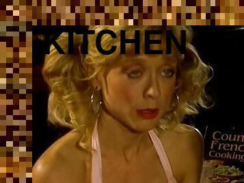 Nina Hartley sucks and rides Peter North's cock in the kitchen