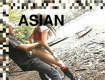 Asian babe Erika fucked by lake by a stiff cock doggie-style