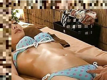 Japanese AV Model wears sexy lingerie as she lays on a bed