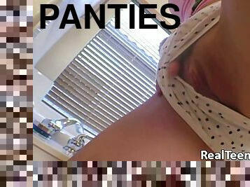 Teen puts a hand down her cotton panties and rubs her pussy