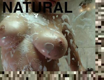 Sabrina Nichole lathers up her luscious tits in a soapy shower