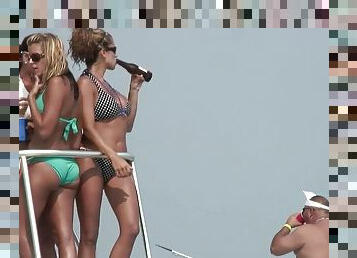Boat party on a beach with hundreds of hot girls all around