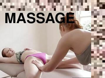 Redhead masseuse licks a naked clients pussy