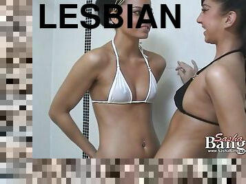 Two sexy babes in bikinis take a shower together and go lesbian