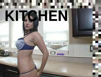 Sunny Leone masturbates her nice pussy in the kitchen